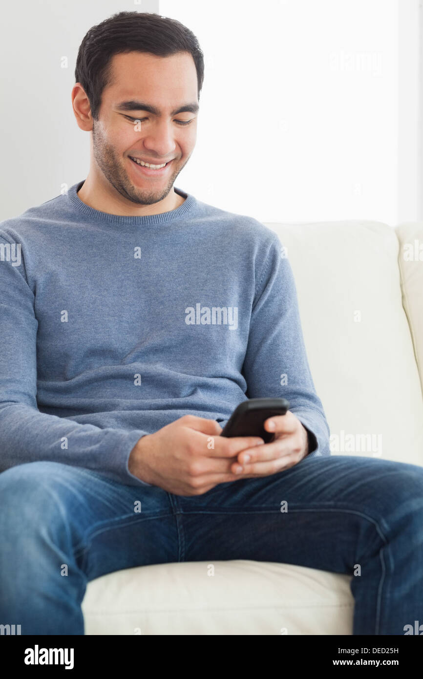 Handsome casual man text messaging Stock Photo
