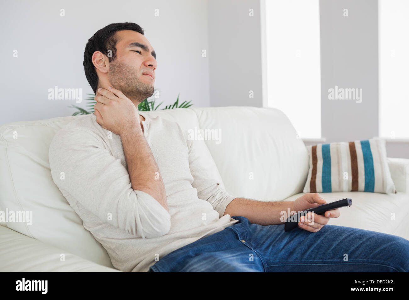 Handsome man suffering from painful neck Stock Photo