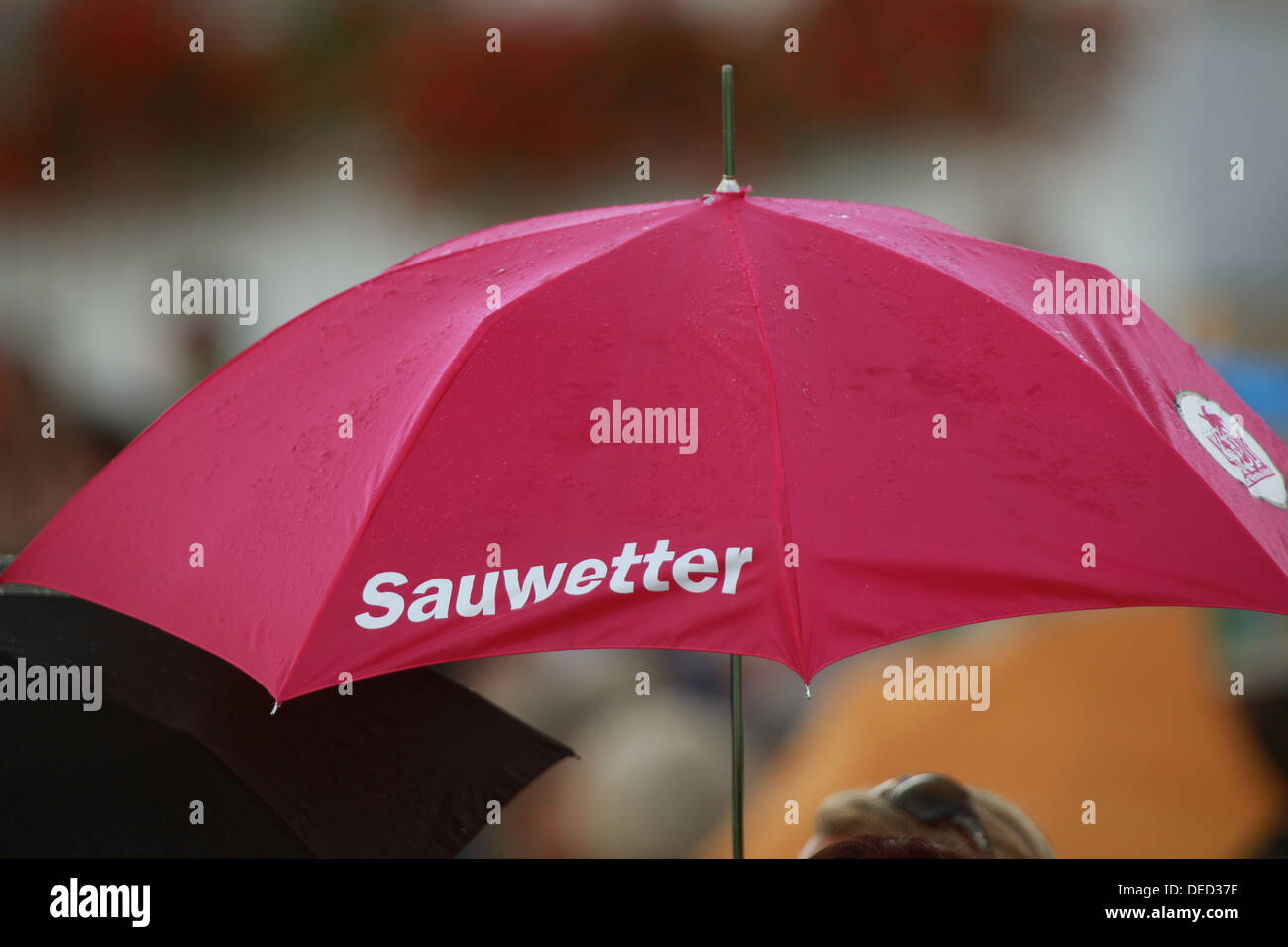 Iffezheim, Germany, umbrella labeled Sauwetter Stock Photo
