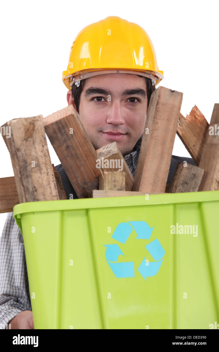 Man carrying wood to be recycled Stock Photo Alamy