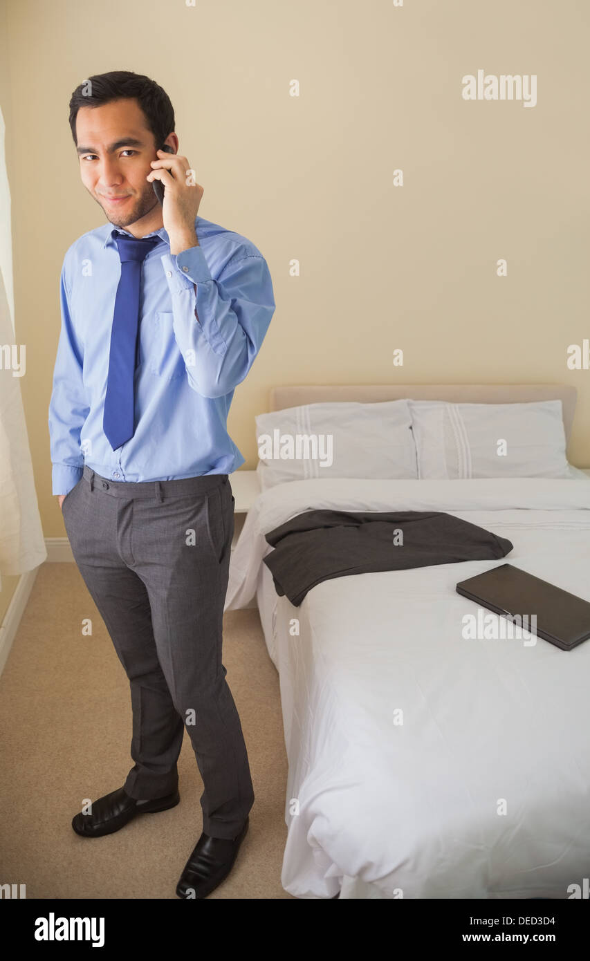 Amused man calling someone with a mobile phone Stock Photo