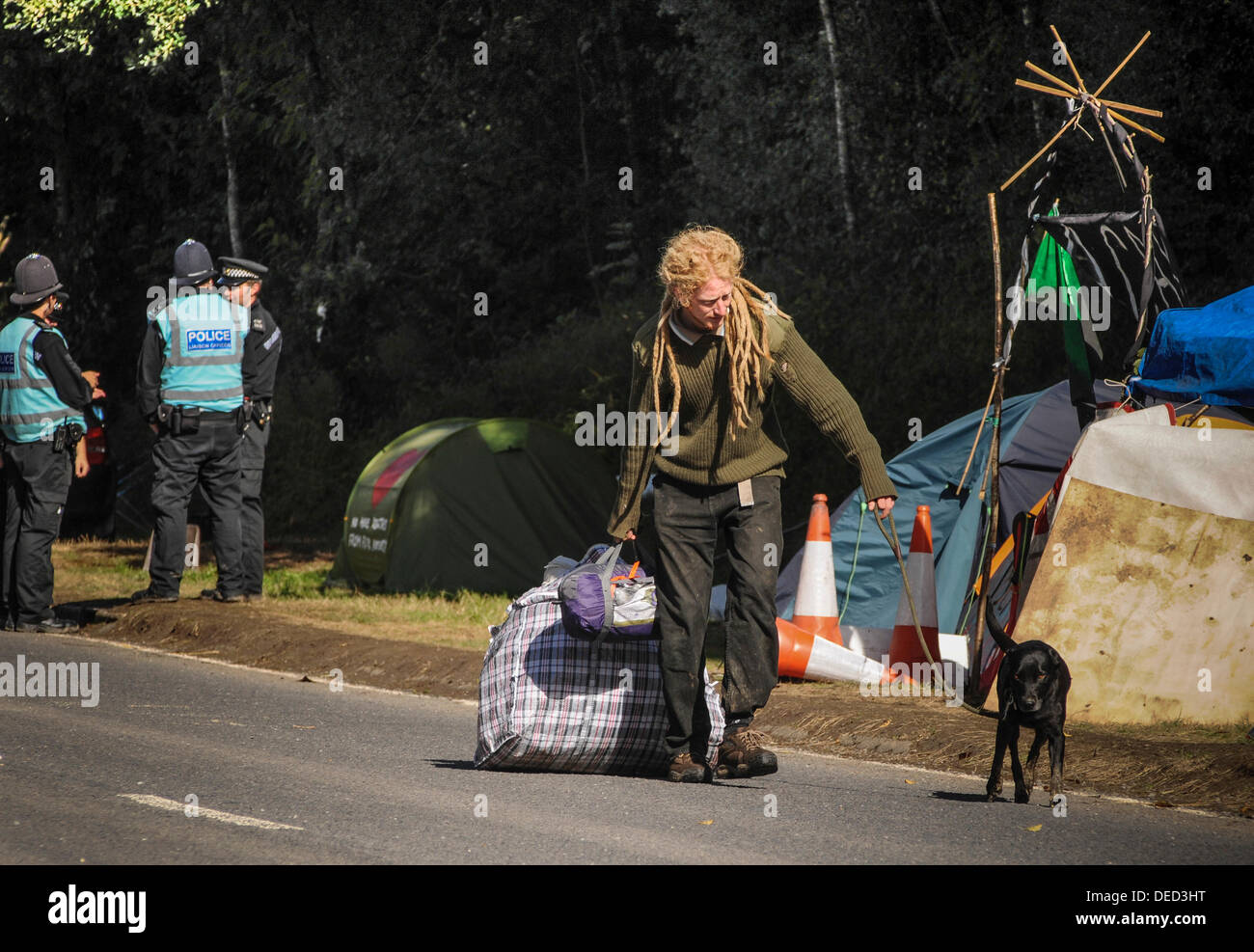 Balcombe, West Sussex, UK.16th Sep, 2013. Environmentalist having tidy up after overnight wind and rain battered the roadside camp .Environmentalists rejoiced after todays failed attempt by West Sussex County  in the high court, due flawed case, to evict them from the road side camp.  Credit:  David Burr/Alamy Live News Stock Photo