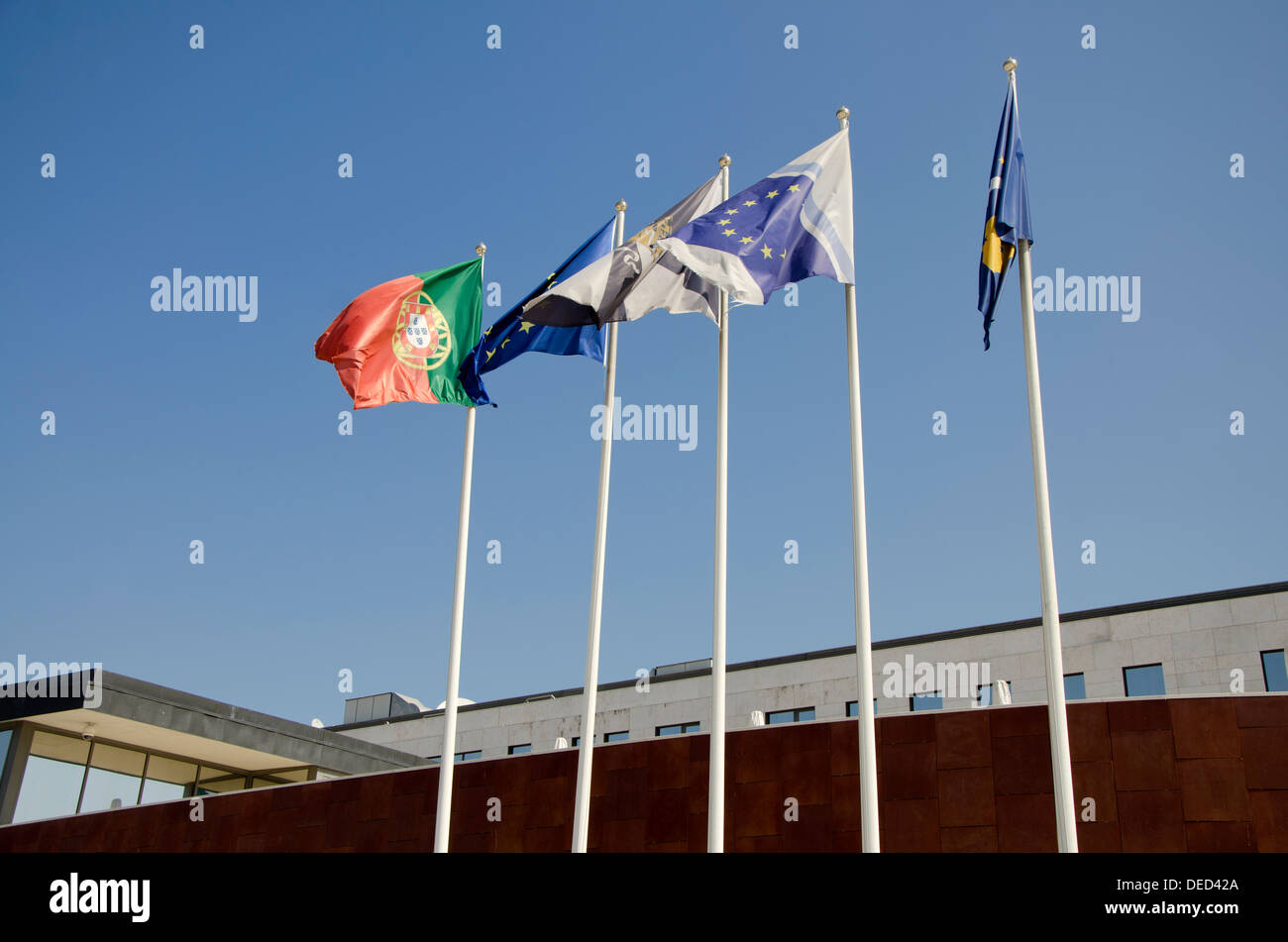 Five flags at the waterfront in Lisbon Portugal Stock Photo