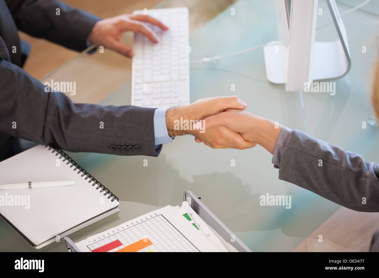 A handshake between business people Stock Photo
