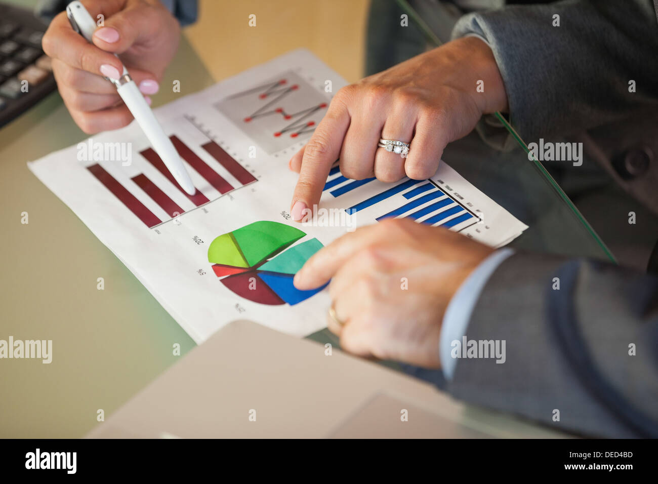 Business team going over data and graphs Stock Photo