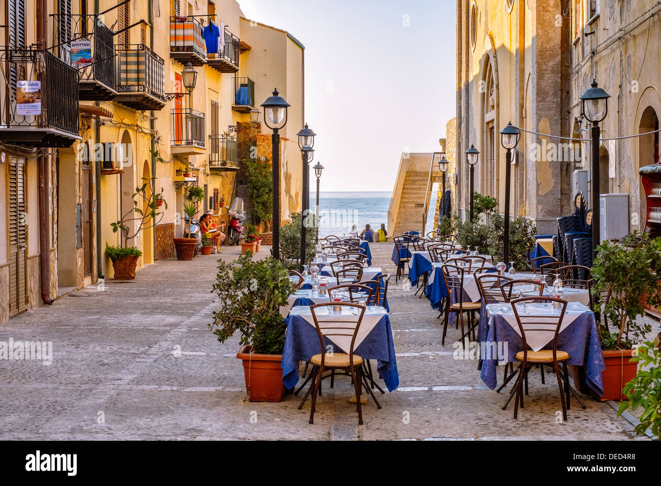 Old town square with a trattoria in Cefalù, Sicily. Cefalu is a major travel destination. Stock Photo