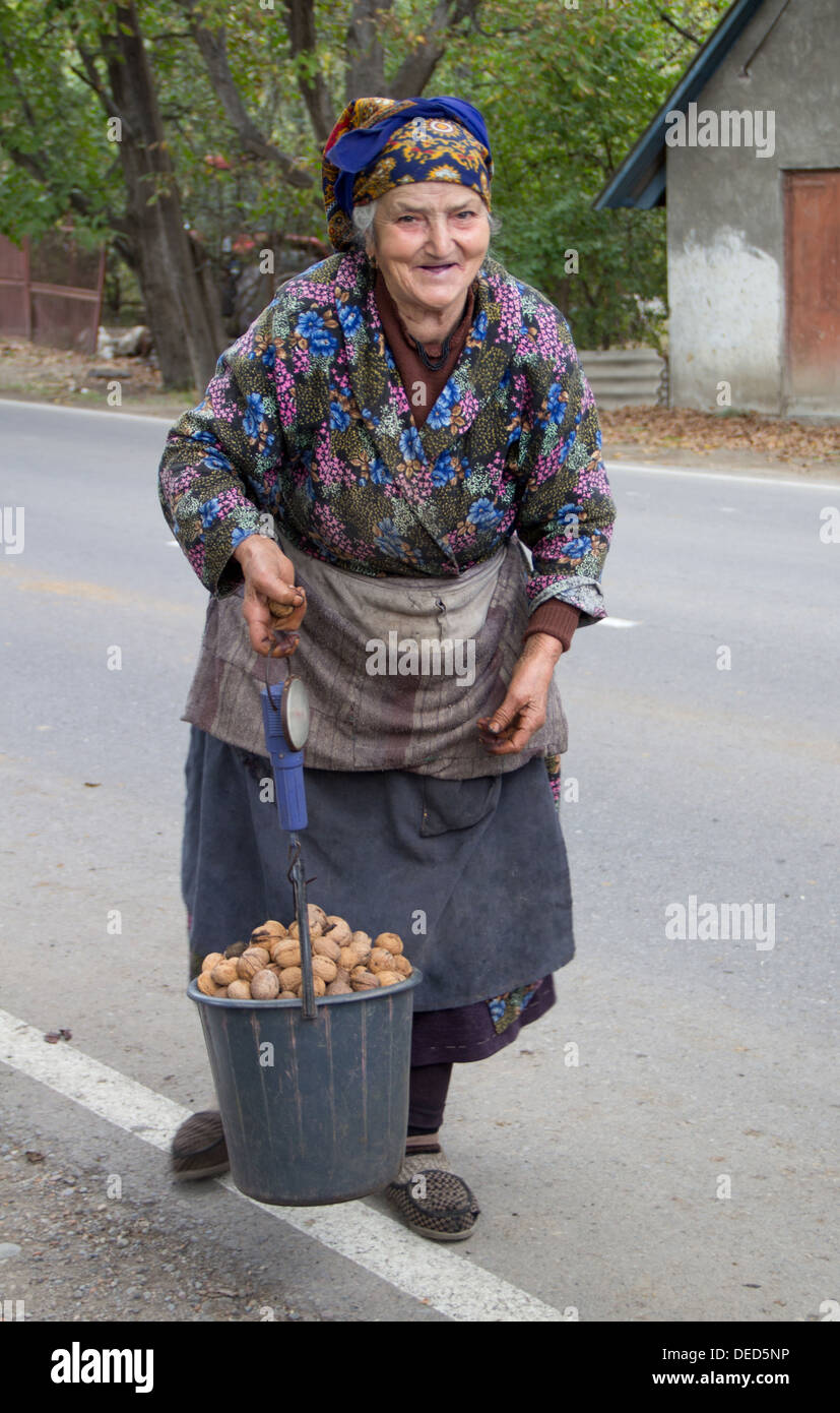Tbilisi, Georgia, an old Georgian woman selling potatoes at the roadside Stock Photo