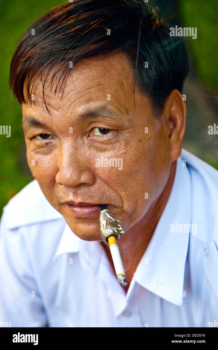 Vietnamese man smoking tobacco hi-res stock photography and images - Alamy