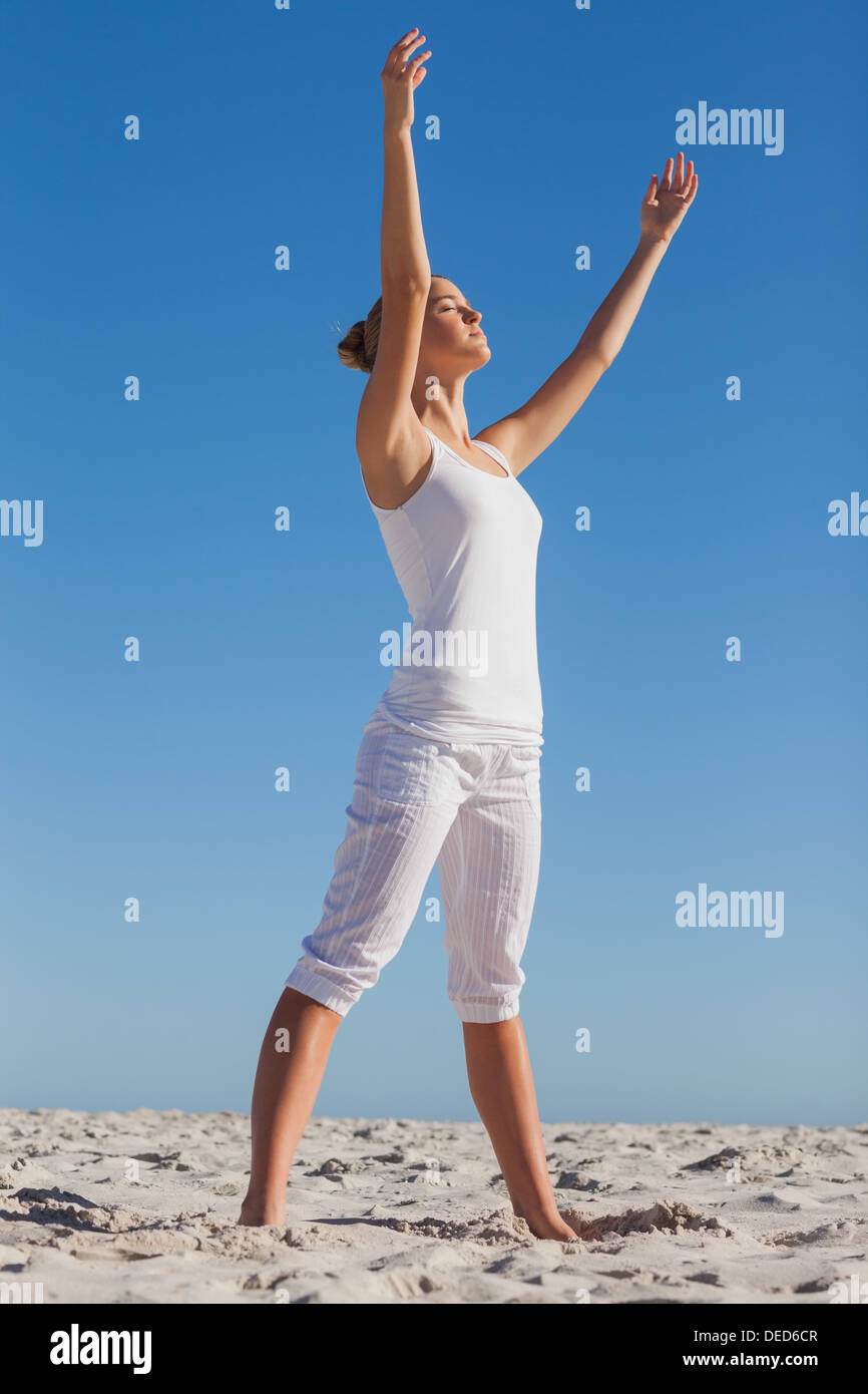 Woman practicing yoga Stock Photo