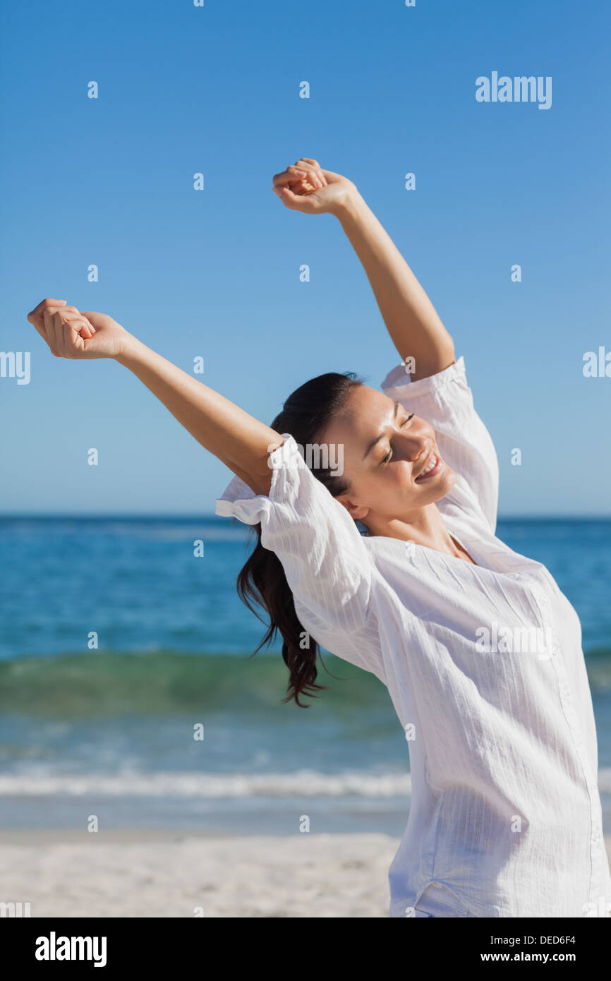 Brunette woman stretching Stock Photo