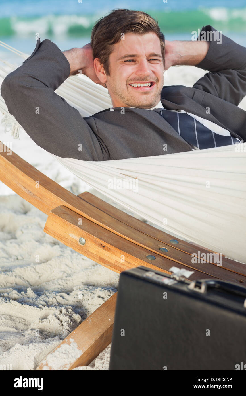Businessman relaxing in a hammock Stock Photo
