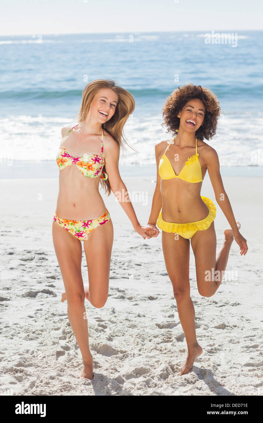 Happy women having fun on the beach Stock Photo