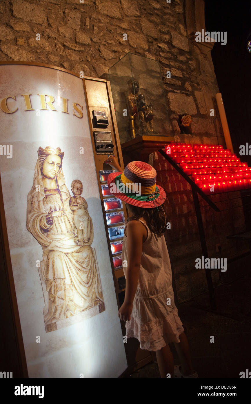 Candles vending machine in St Peter´s church, Pals, Baix Emporda Stock