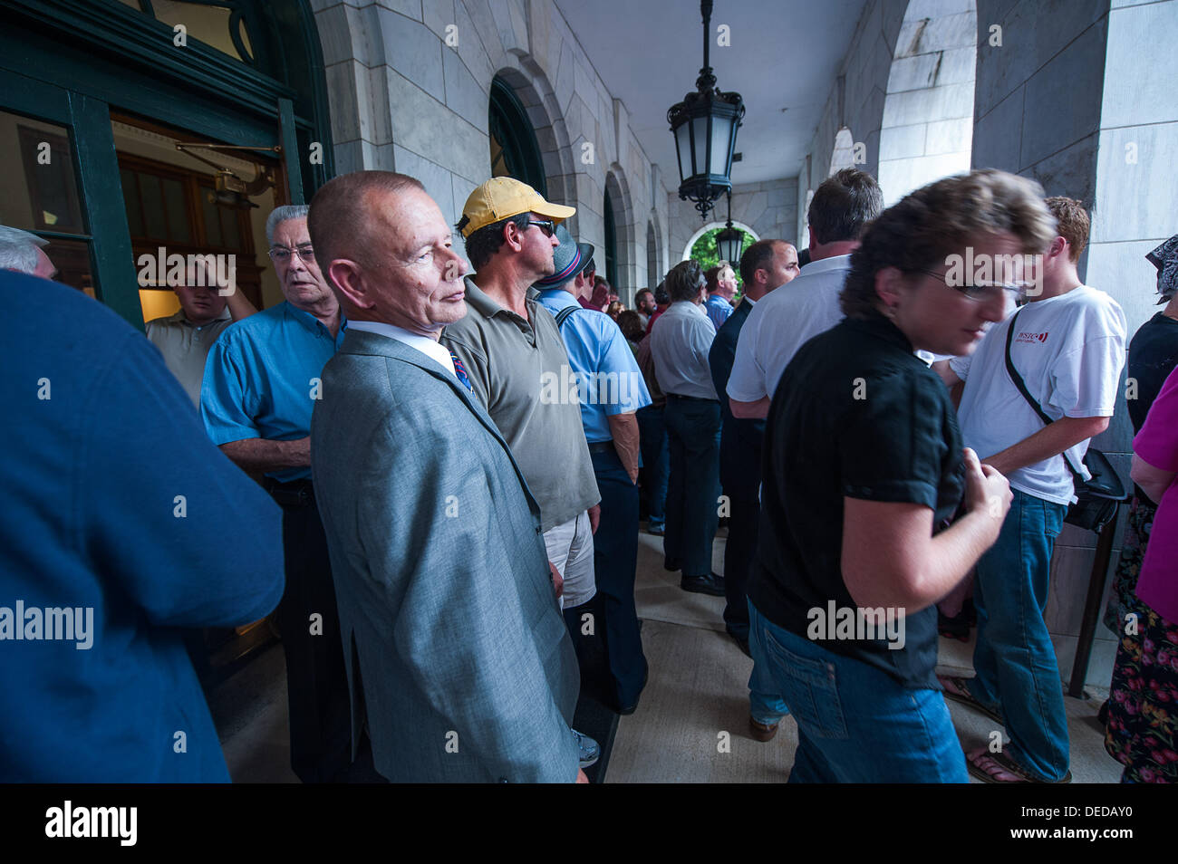 Salisbury, North Carolina, USA. 16th Sep, 2013. Rowan County Commissioner Jim Sides, foreground left, listens to the large crowd gathered on the steps of the Rowan County Administration building in Salisbury, North Carolina to protest the current ACLU lawsuit against the county commissioners for praying in Jesus' name before each monthly meeting. The ''Rally for Prayer'' was hosted by Return America, a Winston-Salem Christian organization. © Sean Meyers/ZUMAPRESS.com/Alamy Live News Stock Photo