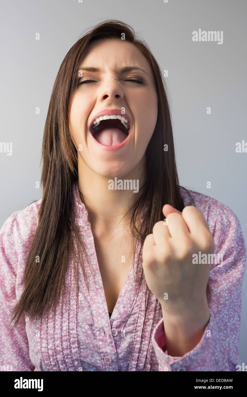 Victorious stylish brunette posing Stock Photo