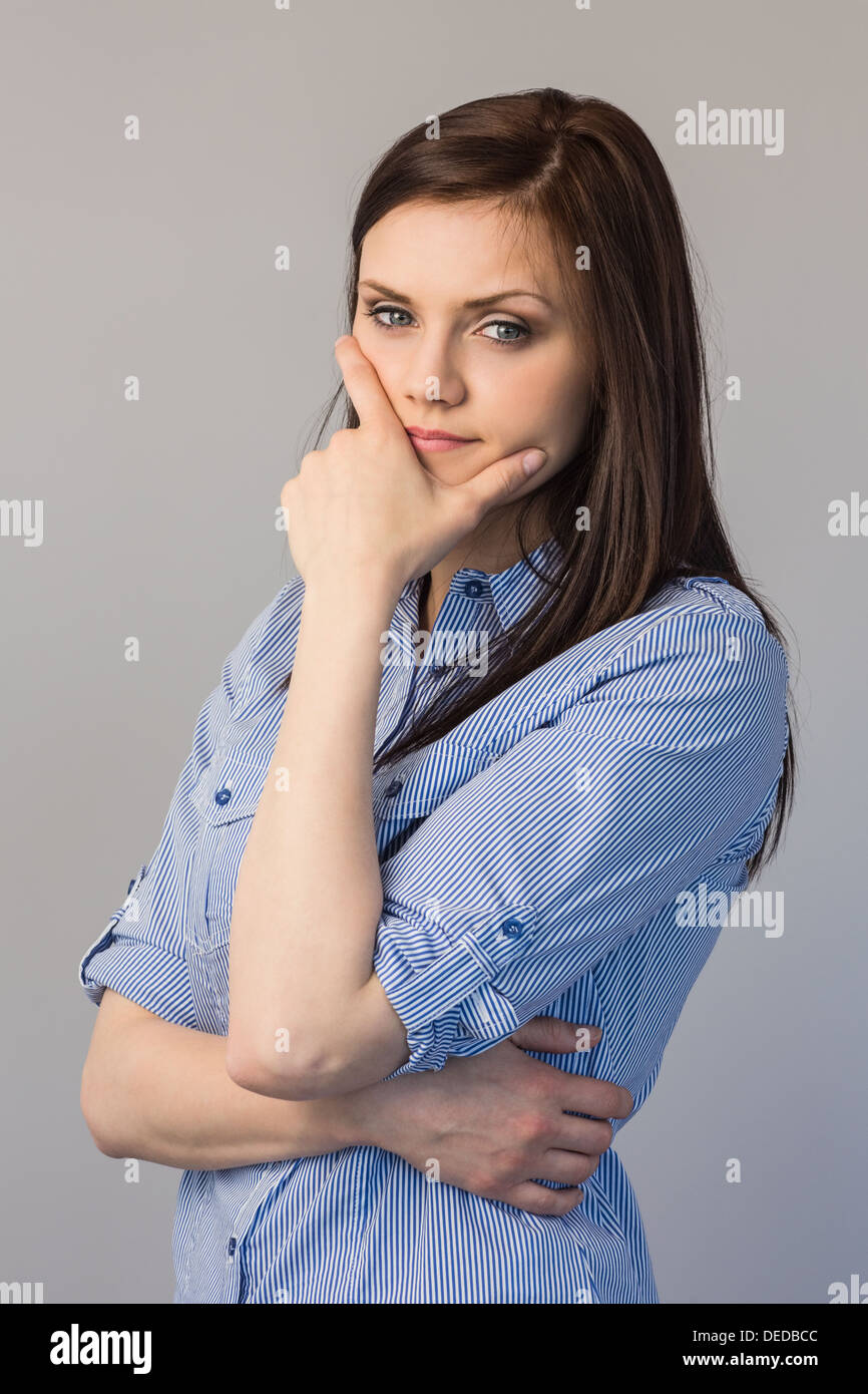 Pensive pretty brunette posing Stock Photo