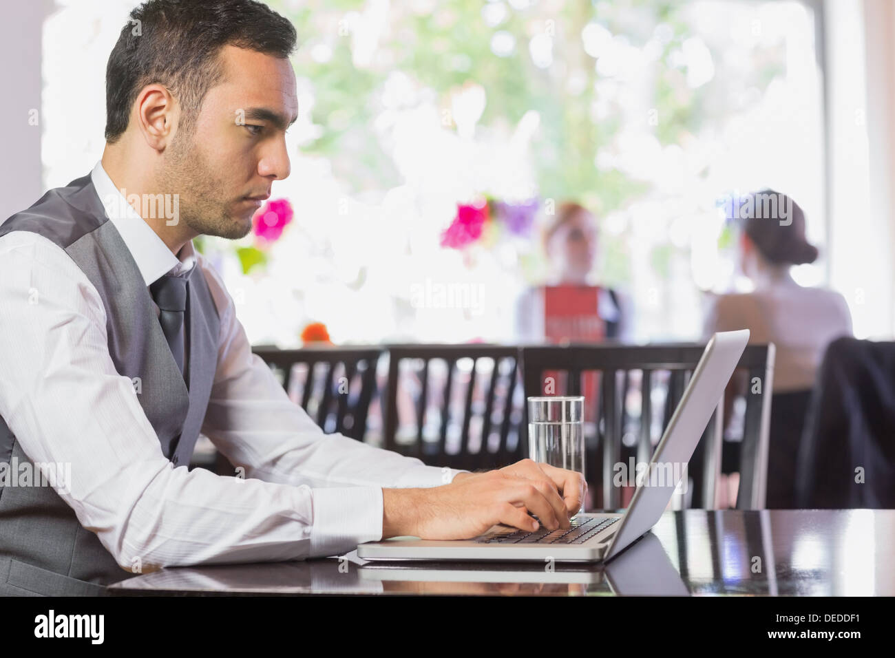 Concentrated businessman working on laptop Stock Photo