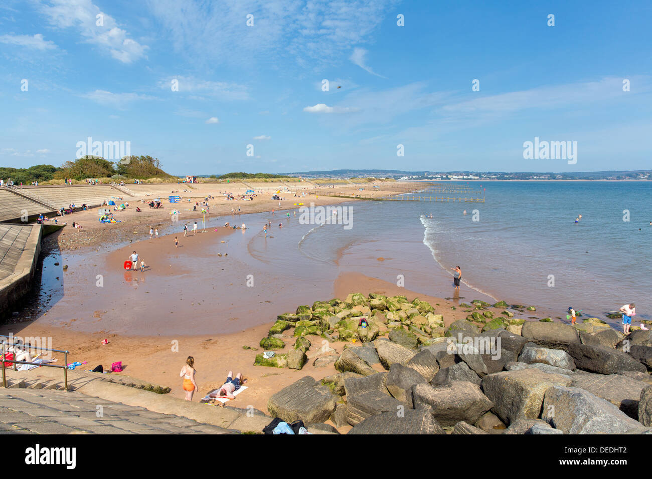 Sandy beach at Dawlish Warren Devon with holidaymakers and sunny weather blue sky summer day Stock Photo