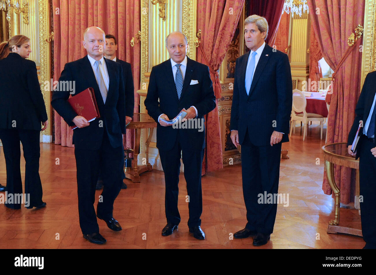 Secretary Kerry Pauses With French Foreign Minister Fabius, British Foreign Secretary Hague Stock Photo