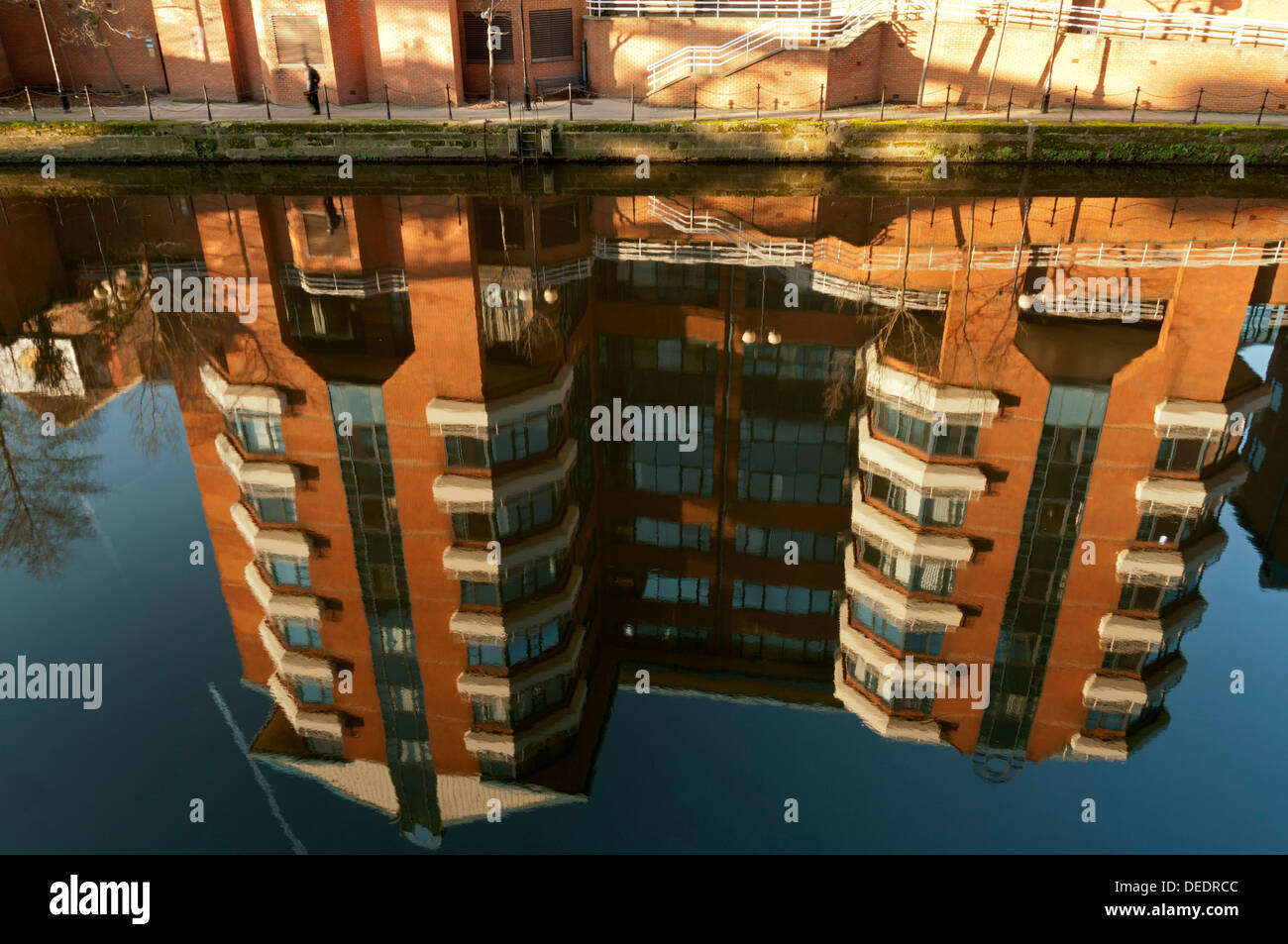 HM Customs and Excise buildings, Ralli Quays, reflected in the river Irwell, Salford, Manchester, England, UK Stock Photo