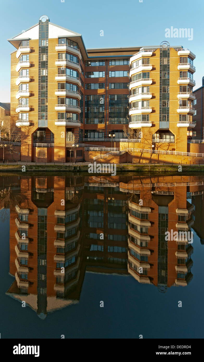 HM Customs and Excise buildings, Ralli Quays, reflected in the river Irwell, Salford, Manchester, England, UK Stock Photo
