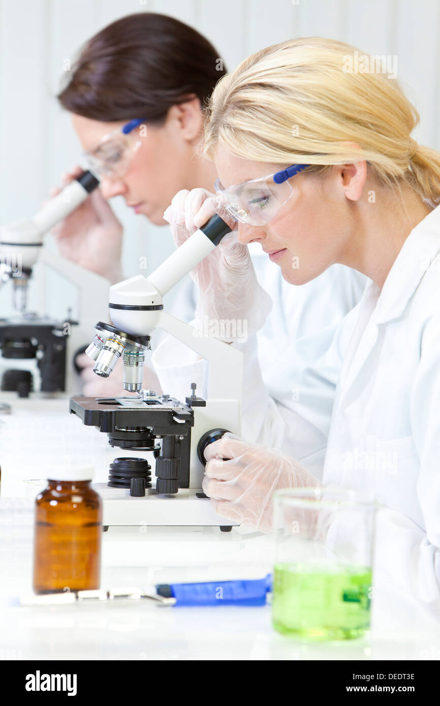 Scientist using microscope in lab hi-res stock photography and images ...