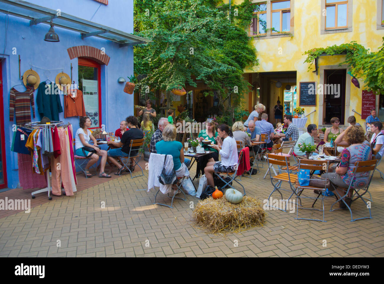 Cafe restaurant terraces Kunsthofpassage courtyard new town Dresden city eastern Germany central Europe Stock Photo