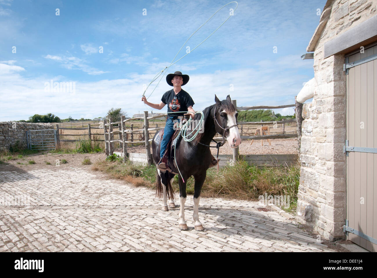 cowboy swinging a lasso Stock Photo