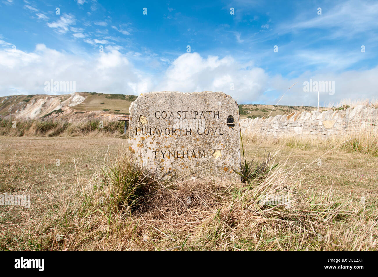 stone coast path sign, Lulworth Cove and Tyneham in Dorset UK Stock Photo