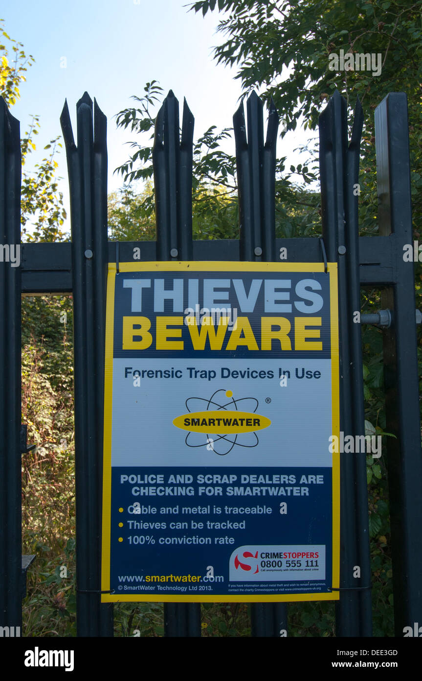 Thieves beware forensic trap devices in use sign Stock Photo