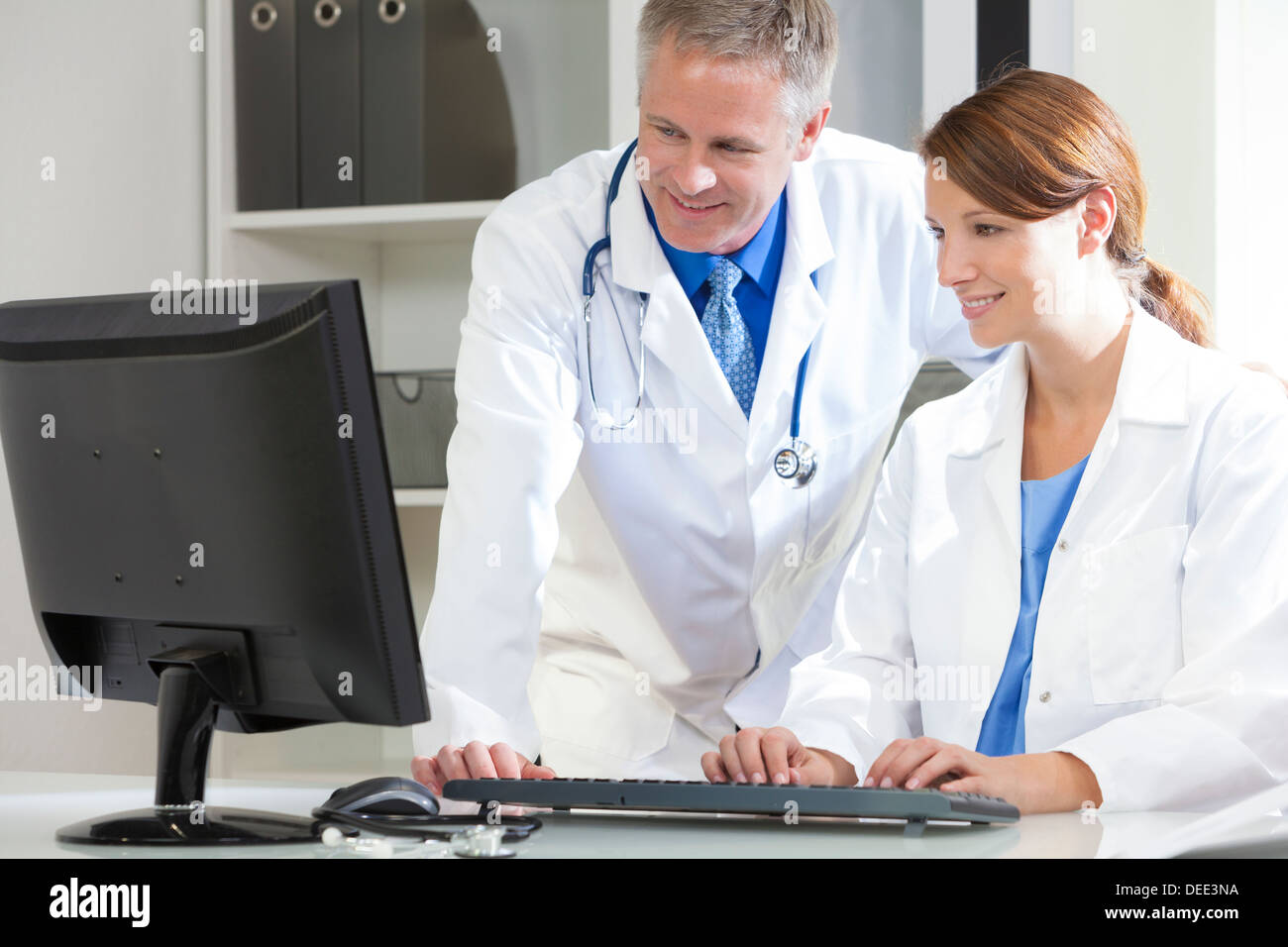 Male & female medical doctors using computer in a hospital office Stock  Photo - Alamy