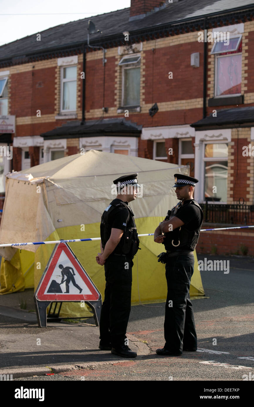 GMP Police on Beard Road Gorton where a man died after being shot with a taser gun Stock Photo