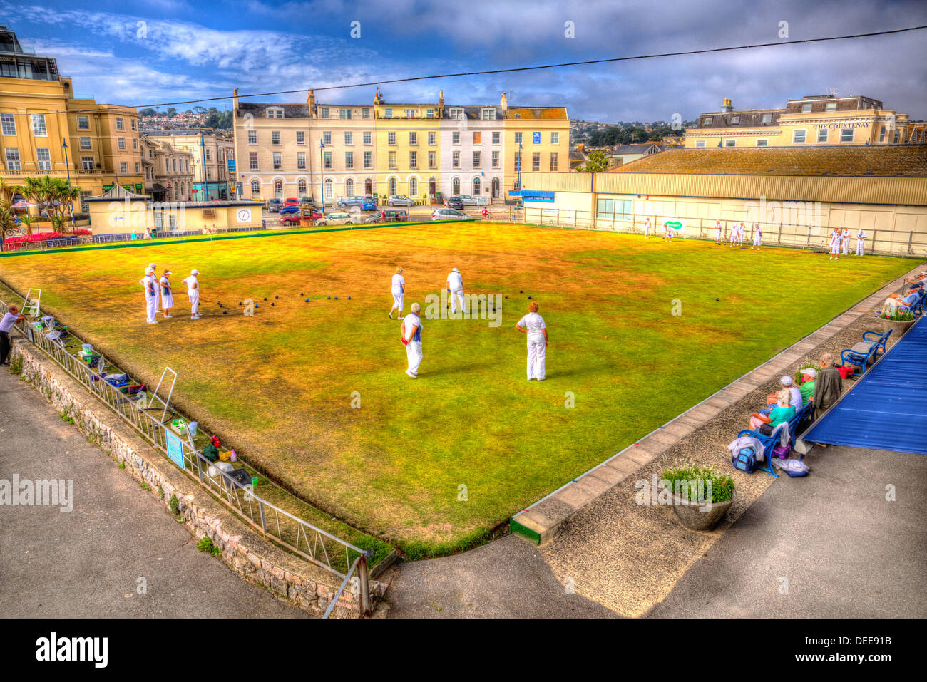 English game of bowls on green lawn on summer day with blue sky in HDR Stock Photo
