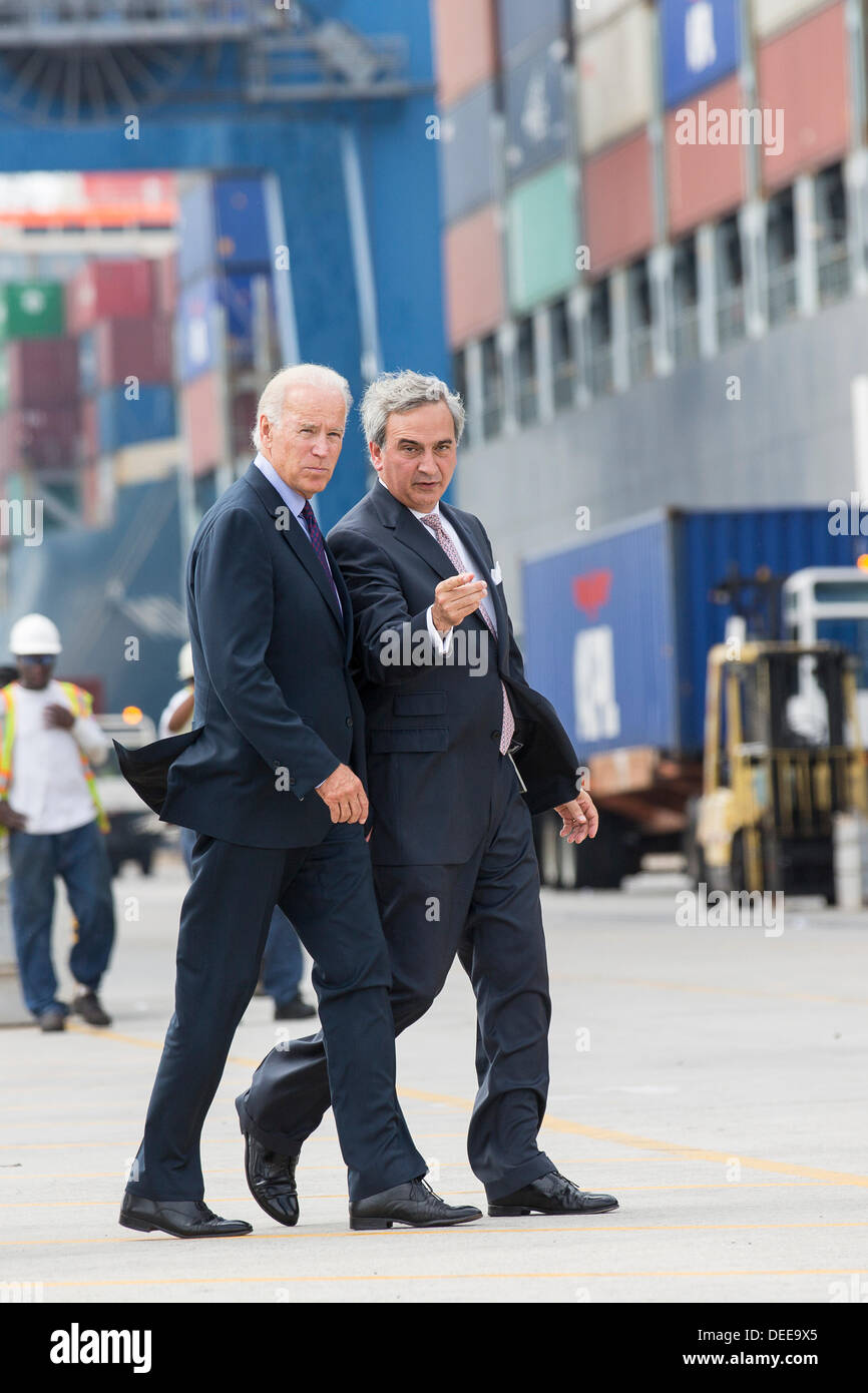 US Vice President Joe Biden walks with Charleston Ports Authority CEO Jim Newsome during a visit to Wando Welch Terminal on September 16, 2013 in Charleston, South Carolina. Biden spoke about the need to improve America's transportation infrastructures for exports and economic growth. Stock Photo