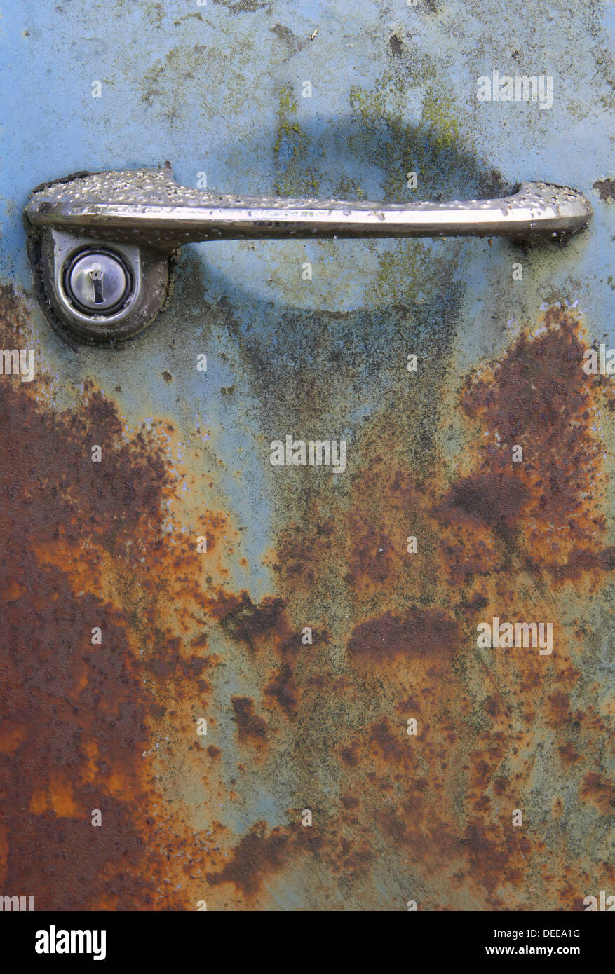 Detail handle. Old and rusty junkcars at junkyard in nature. Kyrkömosse