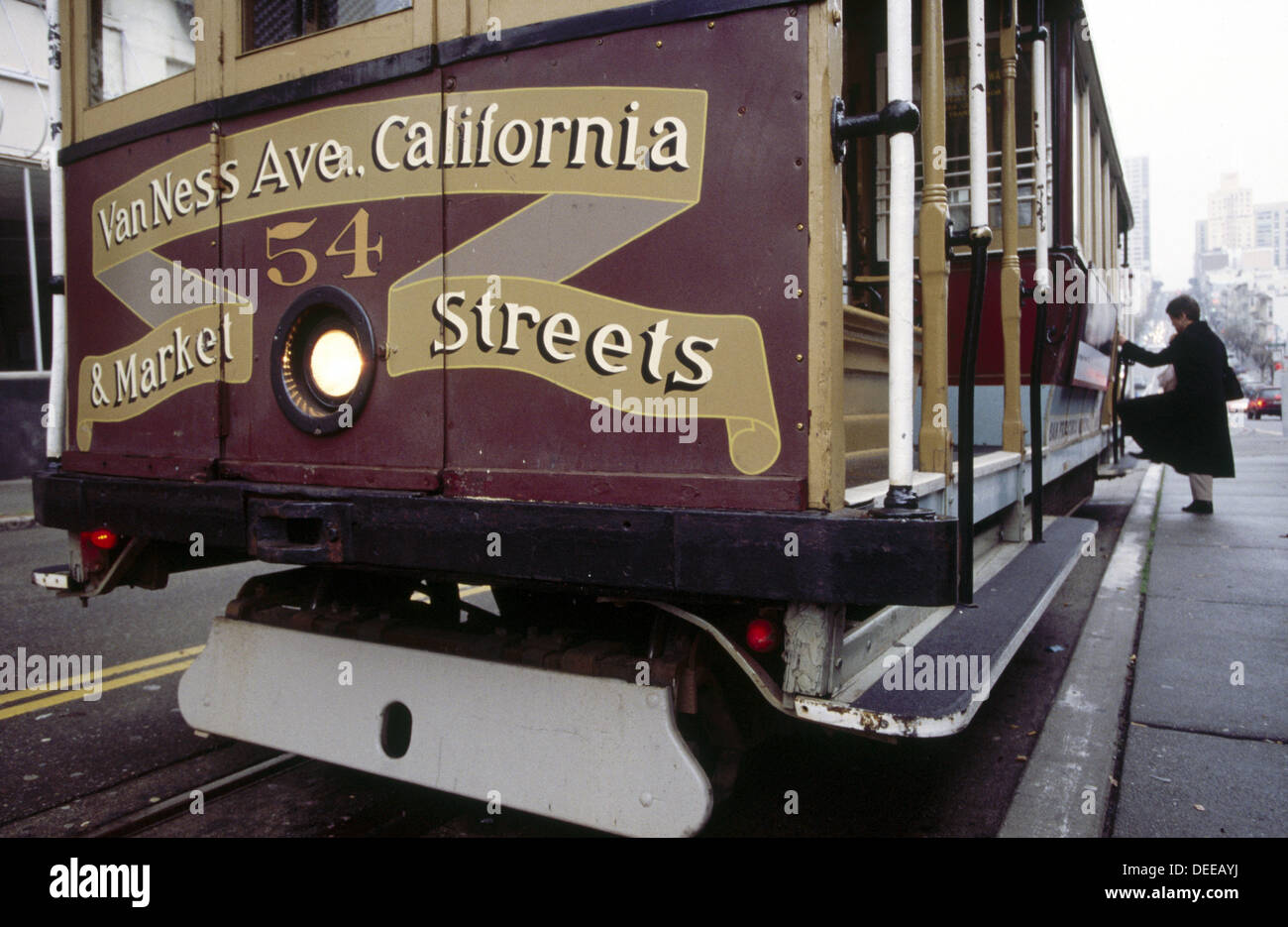 Woman and Van Ness Avenue California and Market Streets cable car. San