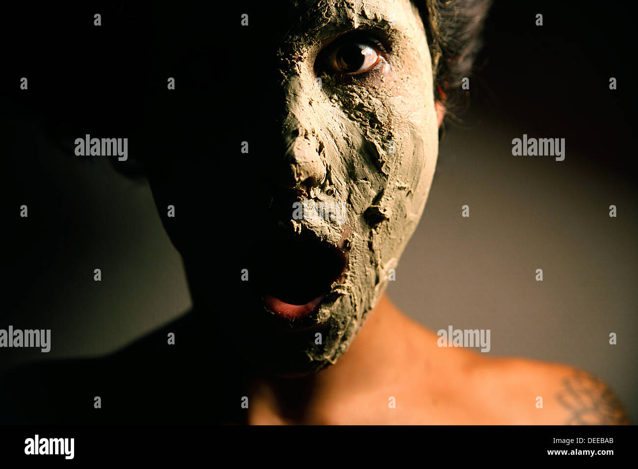 woman with clay mask Stock Photo