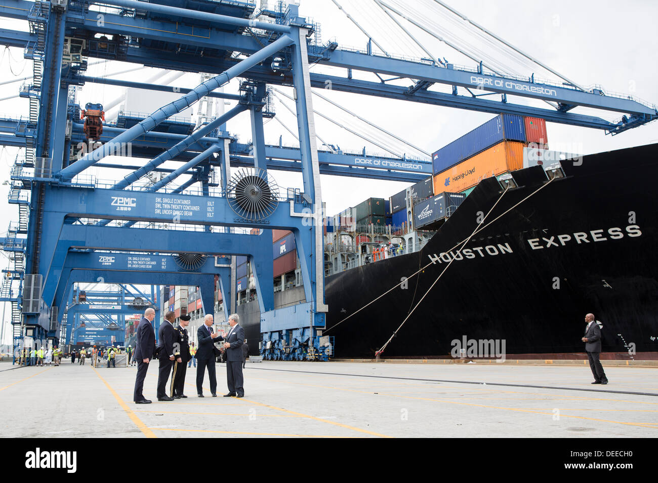 US Vice President Joe Biden speaks with Charleston Ports Authority CEO Jim Newsome, right, General Jackson and Transportation Secretary Anthony Foxx during a visit to Wando Welch Terminal on September 16, 2013 in Charleston, South Carolina. Biden spoke about the need to improve America's transportation infrastructure for exports and economic growth. Stock Photo