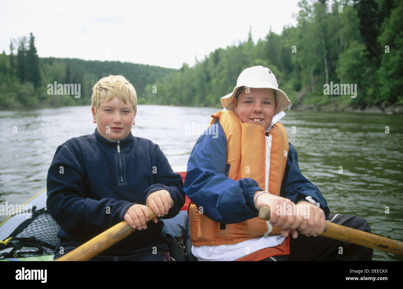 Boys rowing on Stuart River. British Columbia Stock Photo