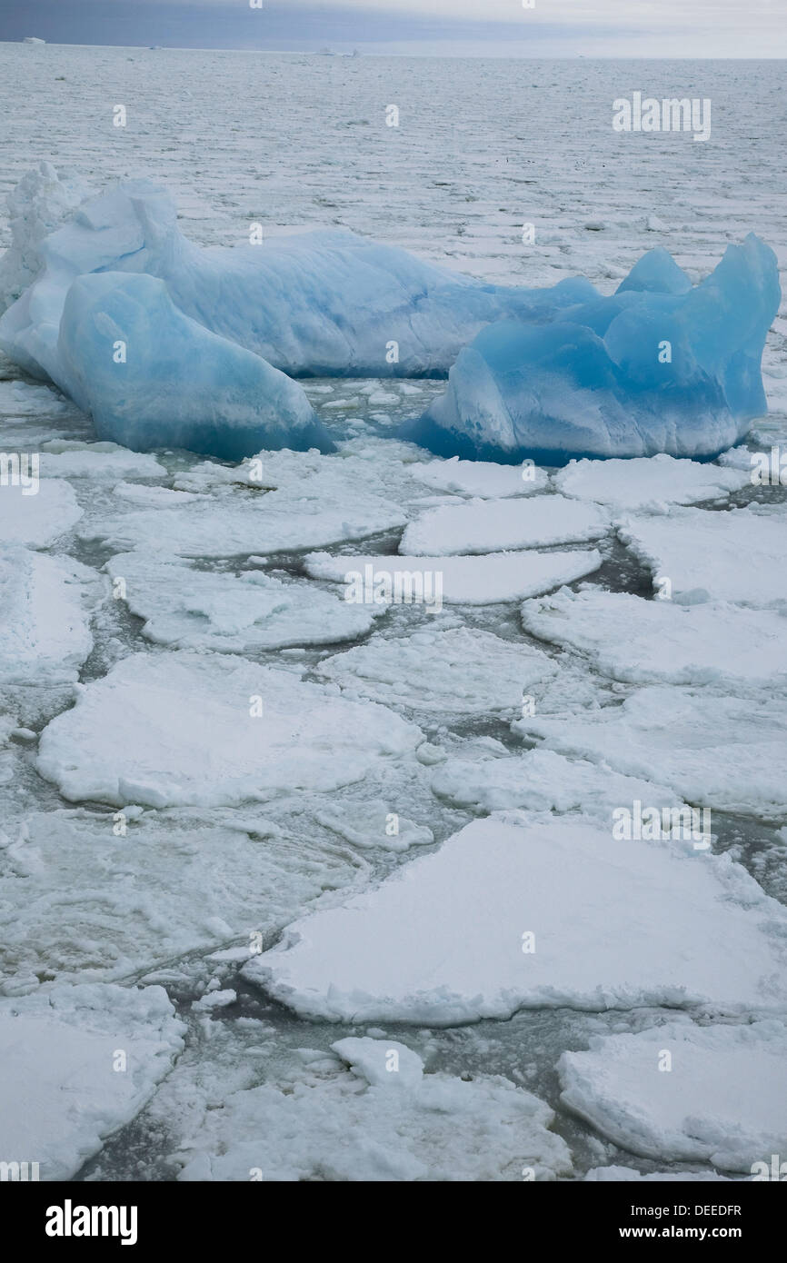 Blue iceberg in heavy pack ice, northern Ross Sea Stock Photo