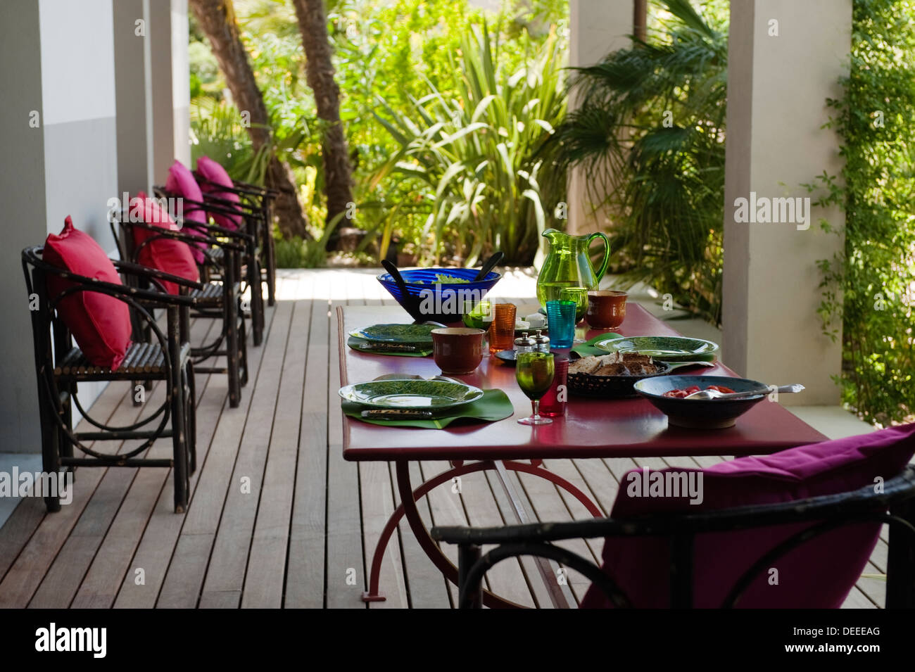 Table and seating on outside terrace in the home of Bruno and Dominique Lafourcade in Provence Stock Photo