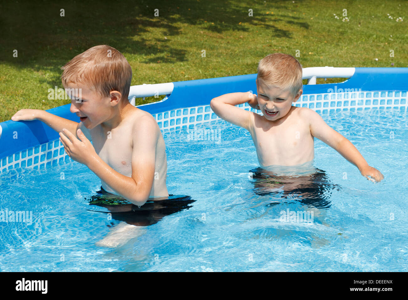 Two boys (47) in swimming pool, France Stock Photo Alamy