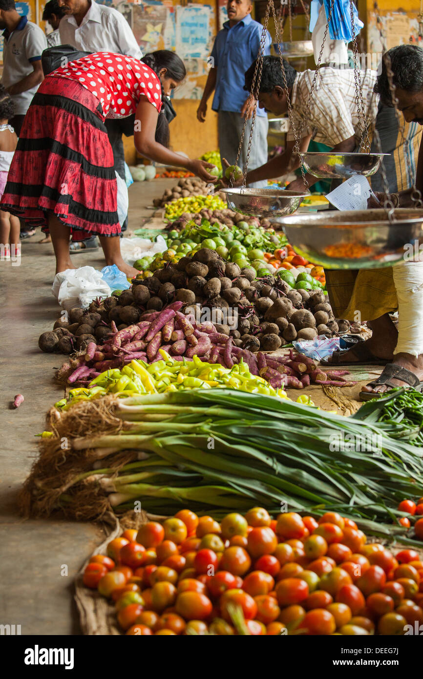Woman buying vegetables on a food market in Sri Lanka Stock Photo