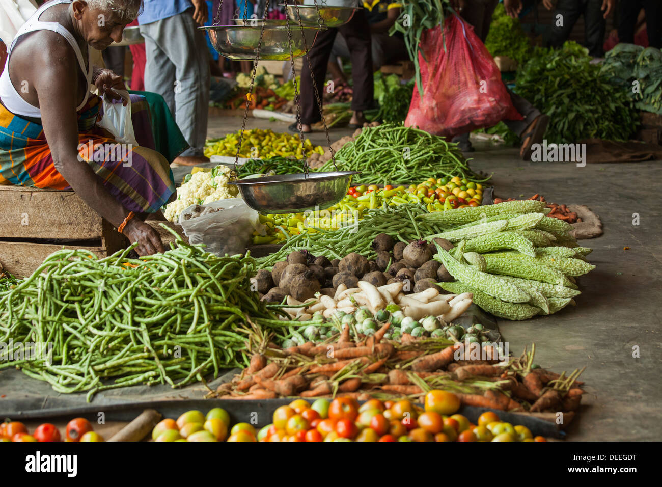 Asian vegetable vendor on a market Stock Photo