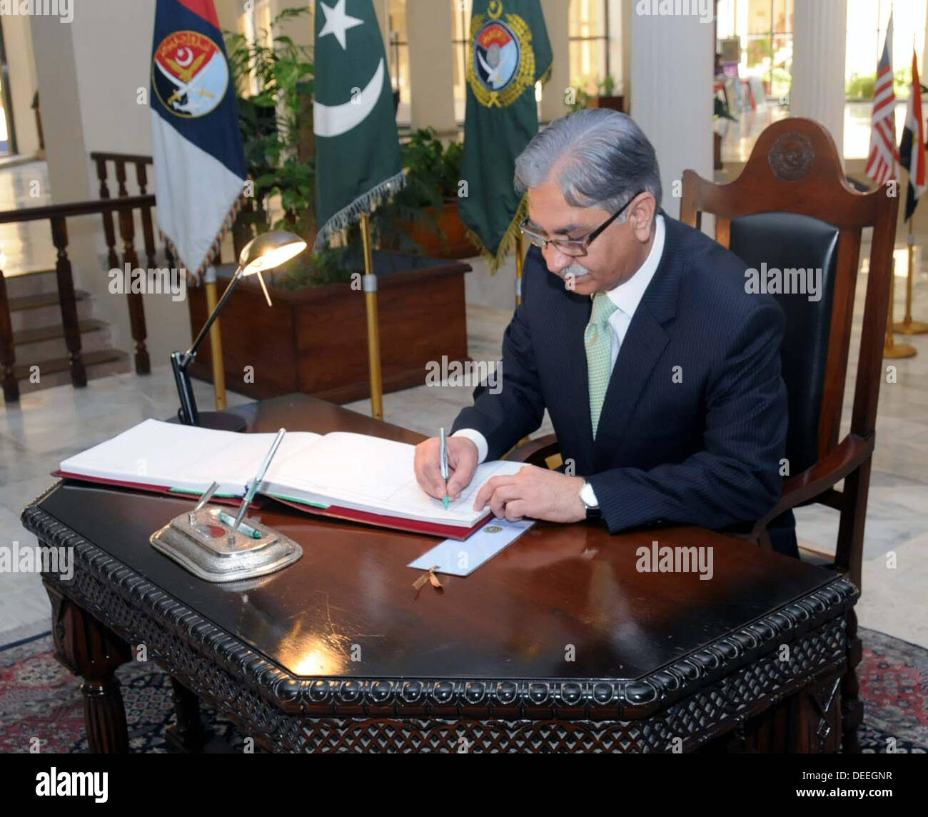 Islamabad, Pakistan. 17th September 2013. Handout image by PID Chairman  senate syed nayyer hussain bokhari writing his commients on visitor book at  national defence univerity ndu (Photo by PID/Deanpictures/Alamy Live News  Stock, image size:1300x1144