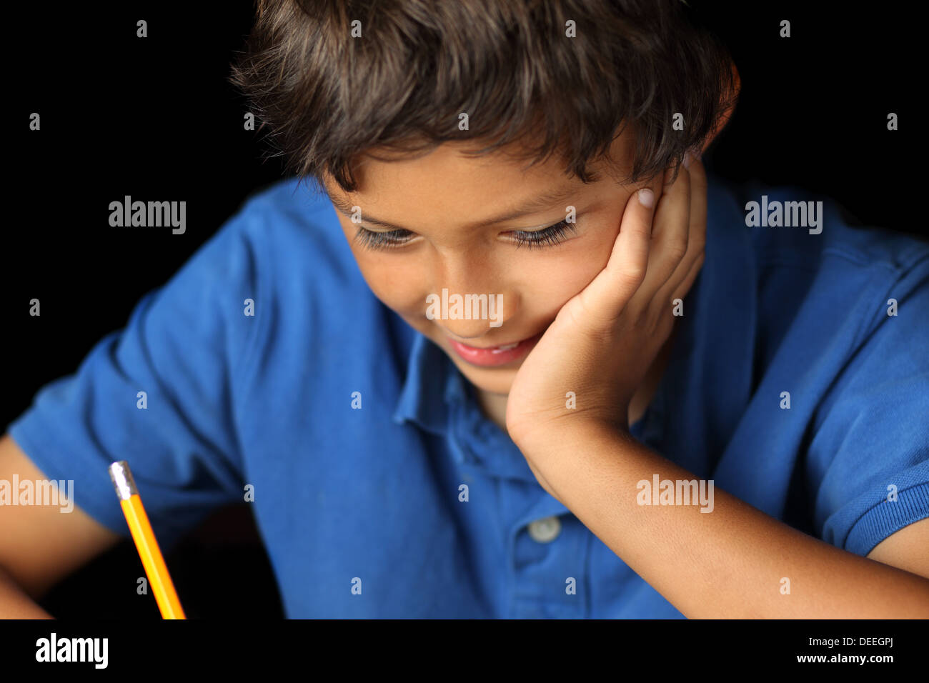 Portrait of young school boy with chiaroscuro lighting - shallow depth of field Stock Photo