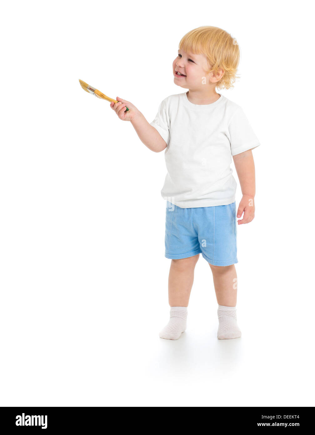 Baby boy with paint brush front view standing full length isolated on white background Stock Photo