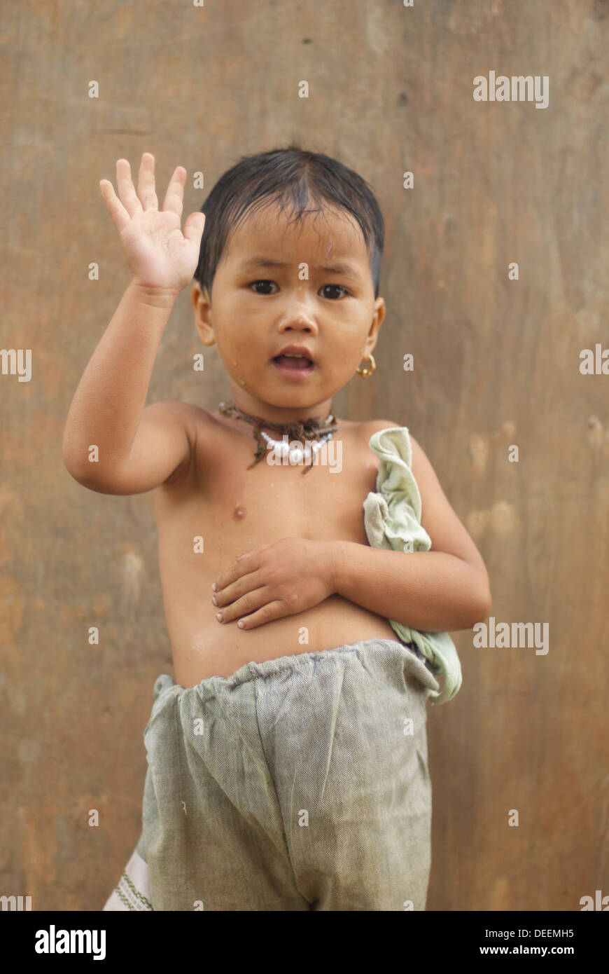 Burmese child waving hello Stock Photo