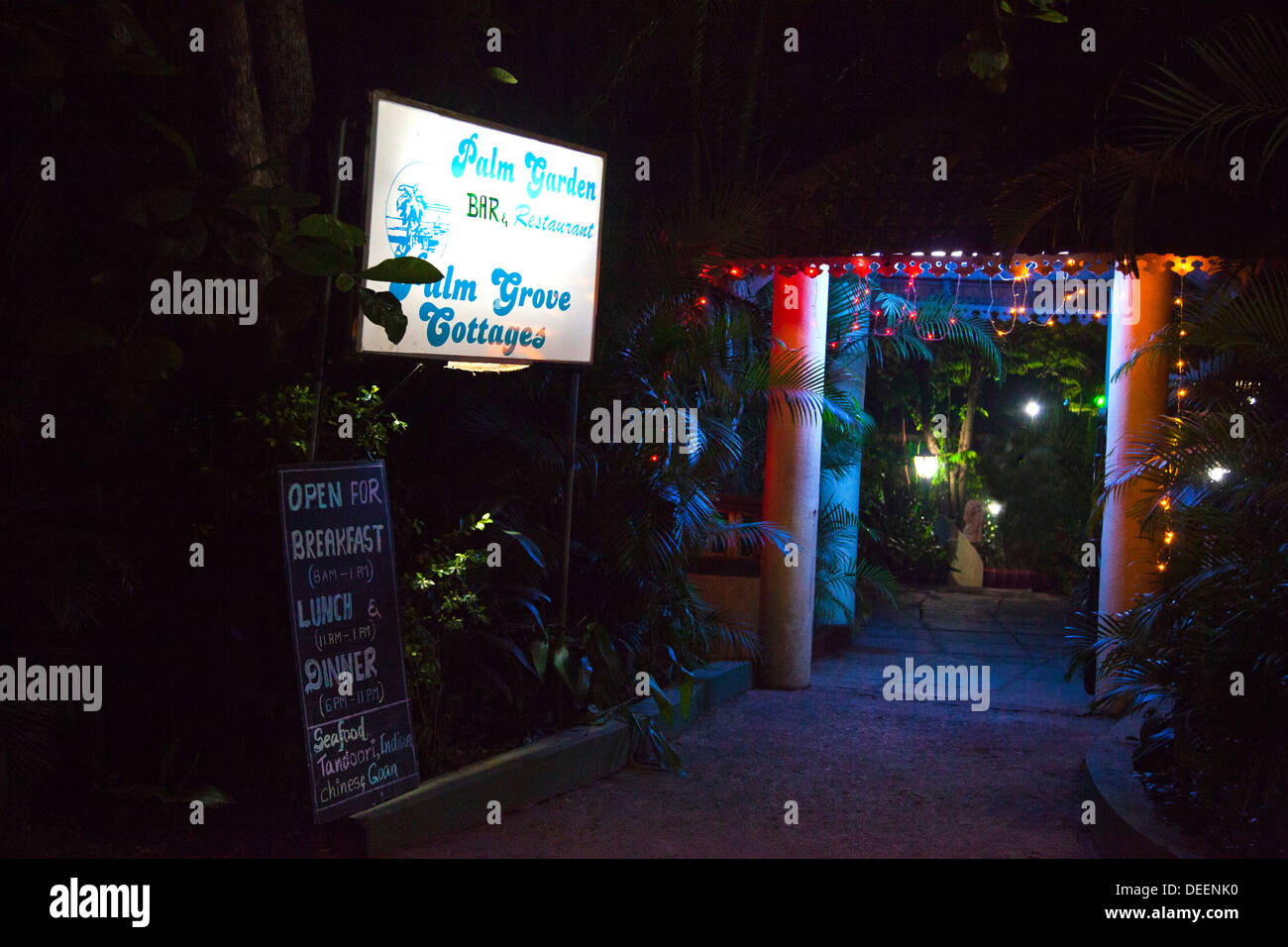 Entrance of a restaurant lit up at night, Palm Garden Restaurant, Panaji, Goa, India Stock Photo