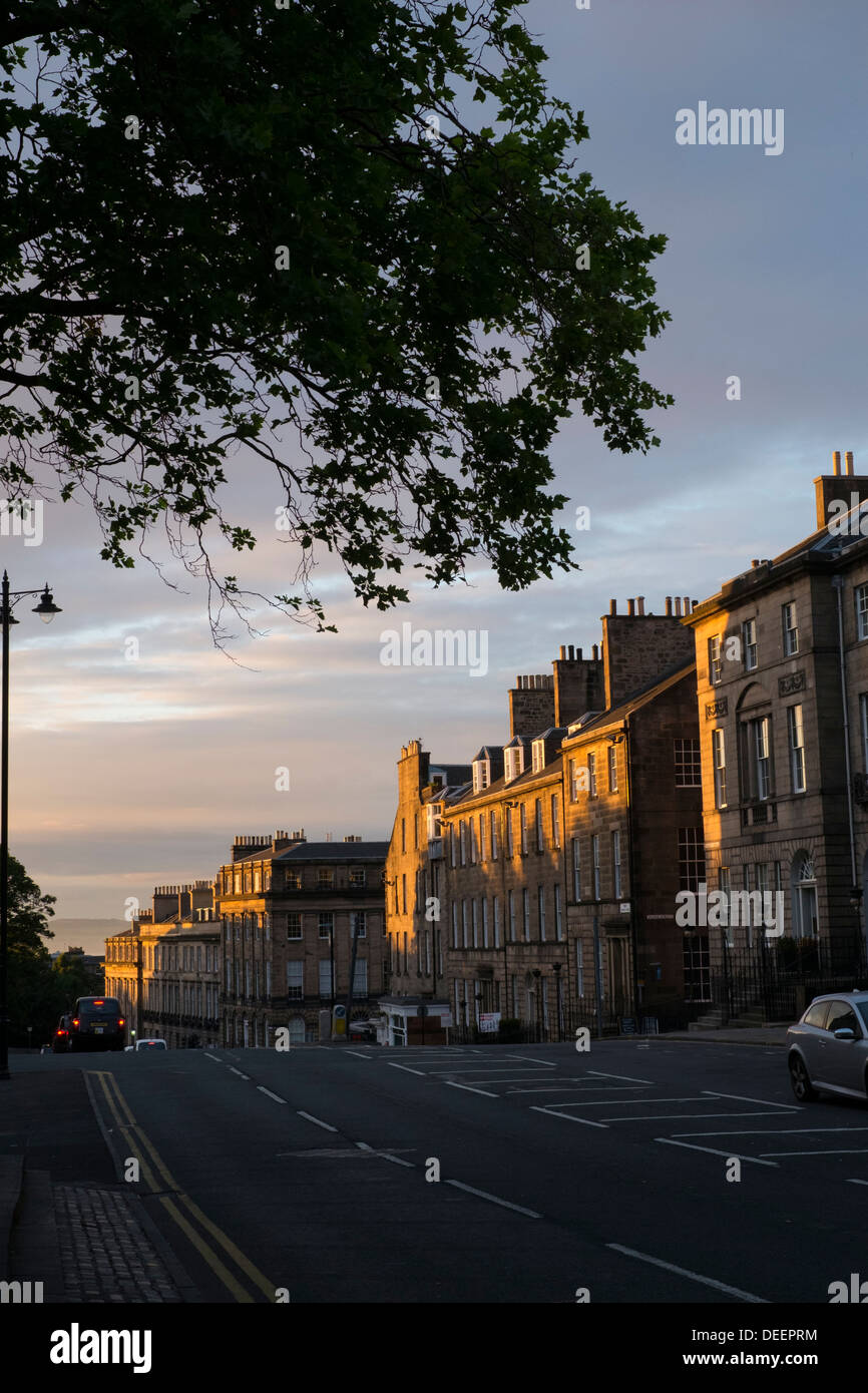 Sun setting on flats in North Charlotte Street, Edinburgh. Stock Photo
